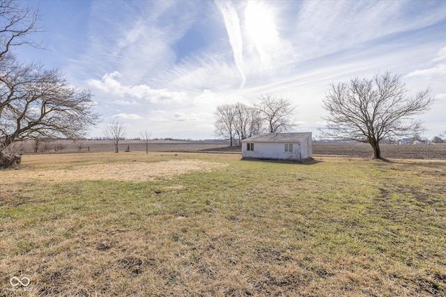 view of yard with a rural view