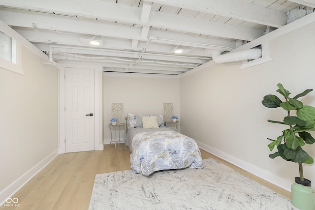 bedroom with hardwood / wood-style flooring