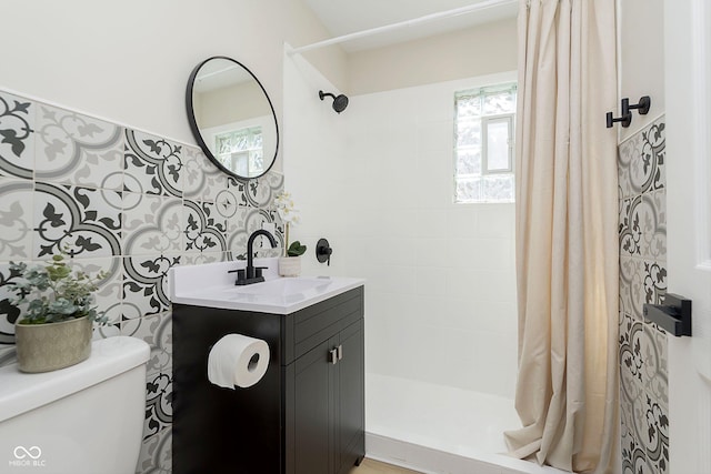 bathroom featuring walk in shower, vanity, and toilet