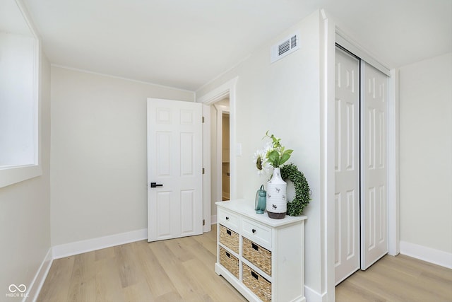 corridor featuring light hardwood / wood-style flooring