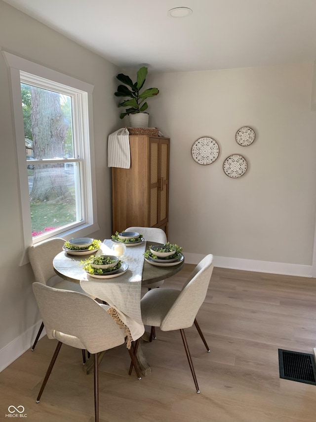 dining room with light wood-type flooring