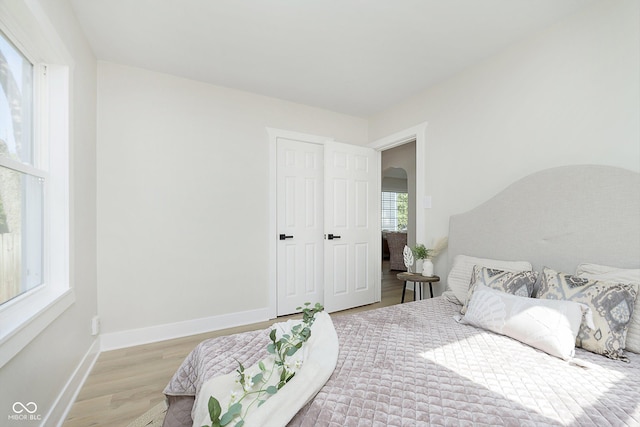 bedroom with light wood-type flooring