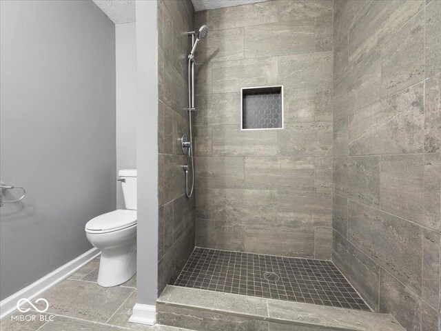 7279 W State Road 44, Shelbyville, IN 46176 - bathroom featuring tiled shower and toilet