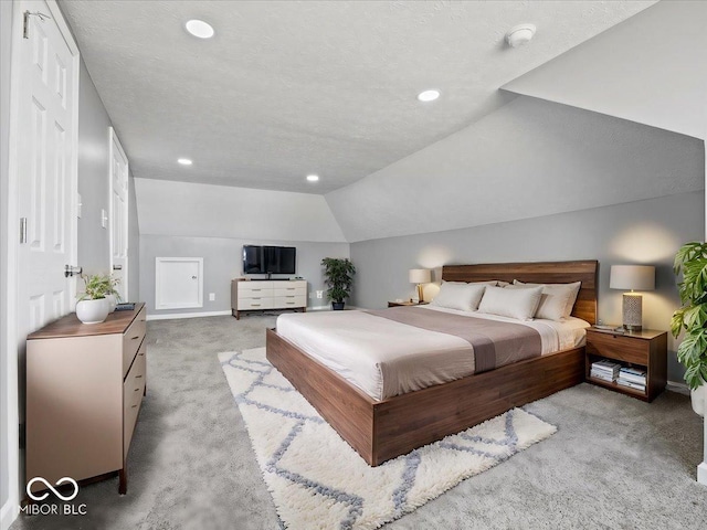 7279 W State Road 44, Shelbyville, IN 46176 - bedroom featuring light carpet, vaulted ceiling, and a textured ceiling