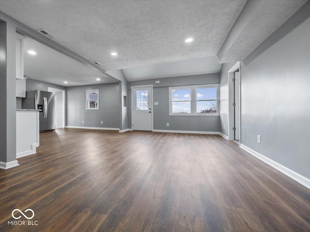 7279 W State Road 44, Shelbyville, IN 46176 - unfurnished living room featuring dark wood-type flooring and a textured ceiling