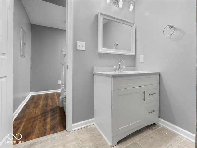 7279 W State Road 44, Shelbyville, IN 46176 - bathroom featuring vanity and hardwood / wood-style flooring