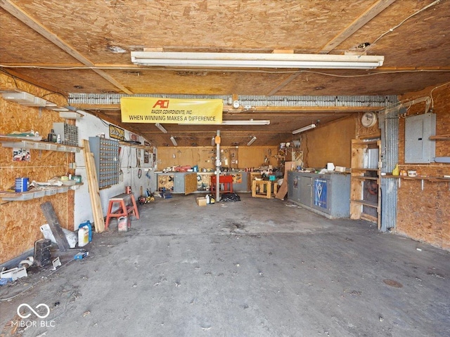 7279 W State Road 44, Shelbyville, IN 46176 - garage with electric panel and a workshop area