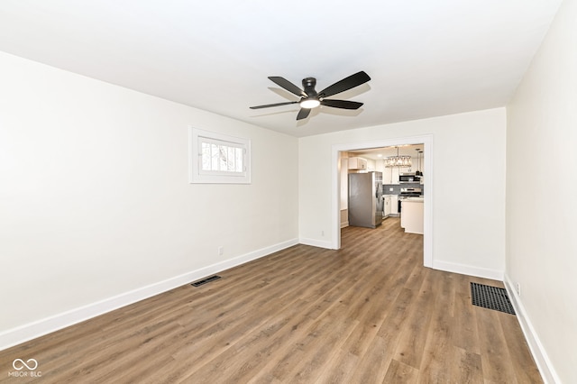 unfurnished room with ceiling fan and light hardwood / wood-style floors