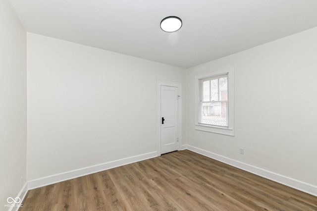 empty room with wood-type flooring