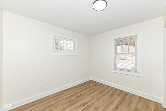 empty room featuring light hardwood / wood-style floors and a healthy amount of sunlight