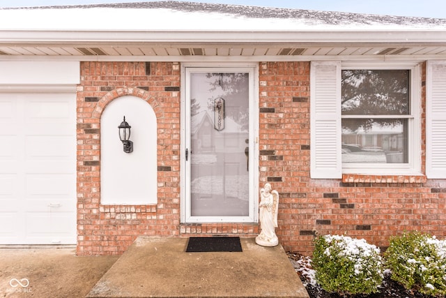 doorway to property featuring a garage