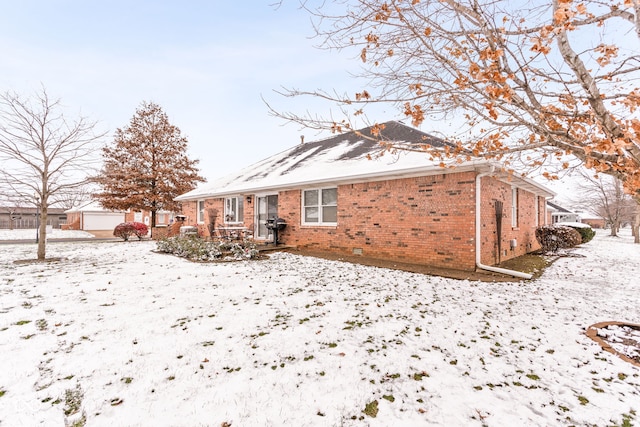 view of snow covered property