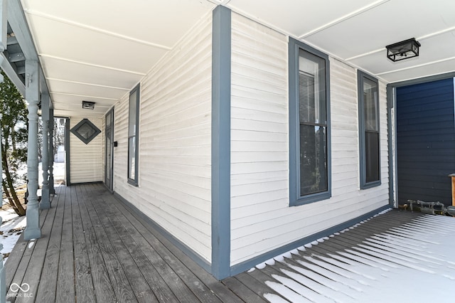 wooden terrace featuring covered porch