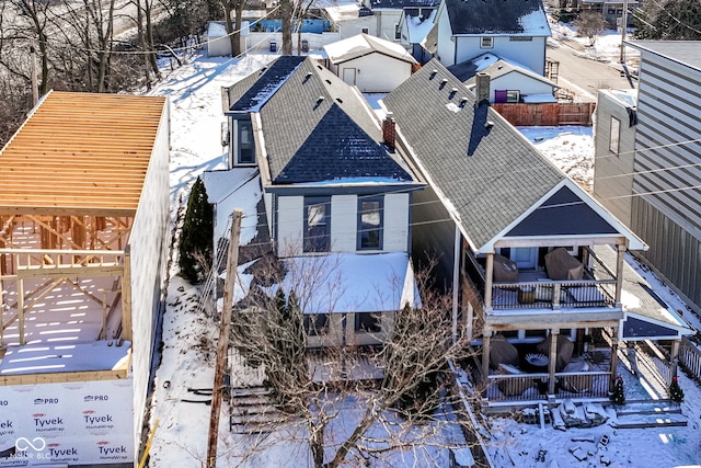 exterior space featuring a shingled roof