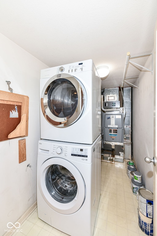 laundry room featuring stacked washer and dryer