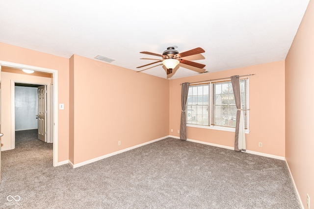 unfurnished room with ceiling fan and carpet flooring