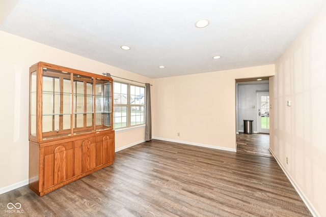 spare room featuring dark hardwood / wood-style floors