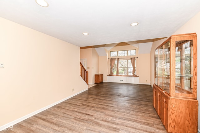 unfurnished living room featuring hardwood / wood-style flooring