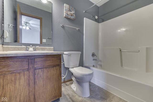 full bathroom with vanity, toilet, tile patterned flooring, and shower / bathing tub combination