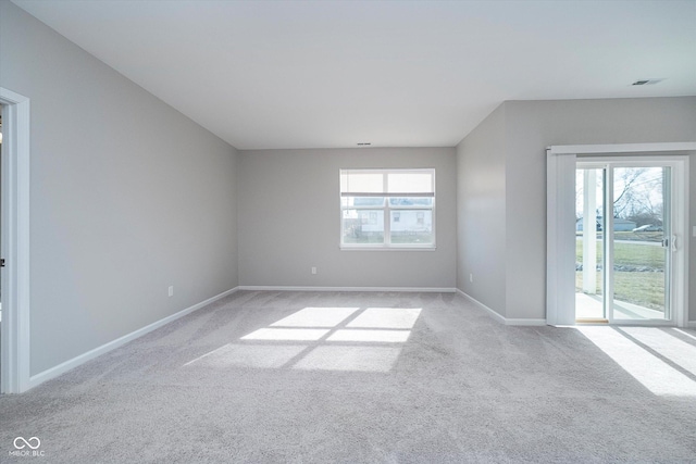 unfurnished room with light carpet