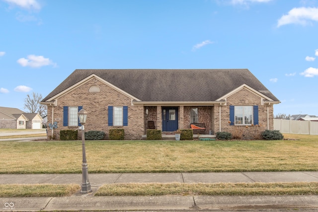 single story home with a front lawn