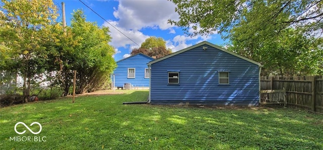 view of property exterior with a yard