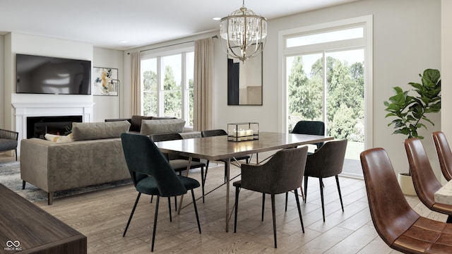 dining area with a notable chandelier and light wood-type flooring