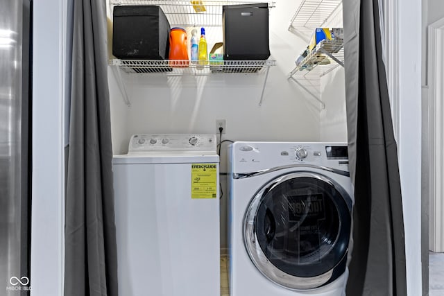 laundry room with washer and dryer