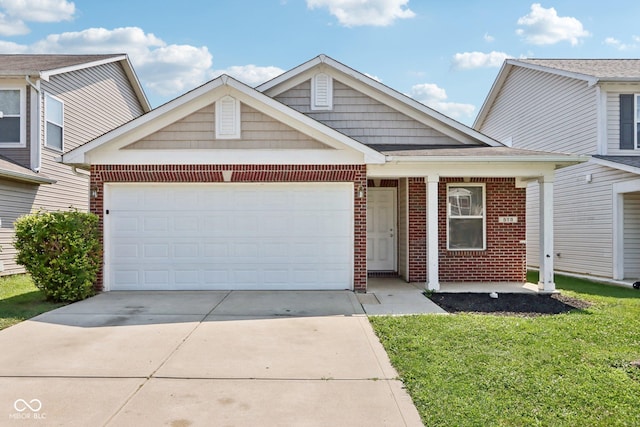 view of front facade featuring a garage and a front lawn