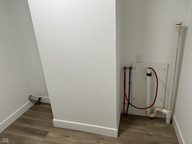 washroom featuring hardwood / wood-style flooring and hookup for a washing machine