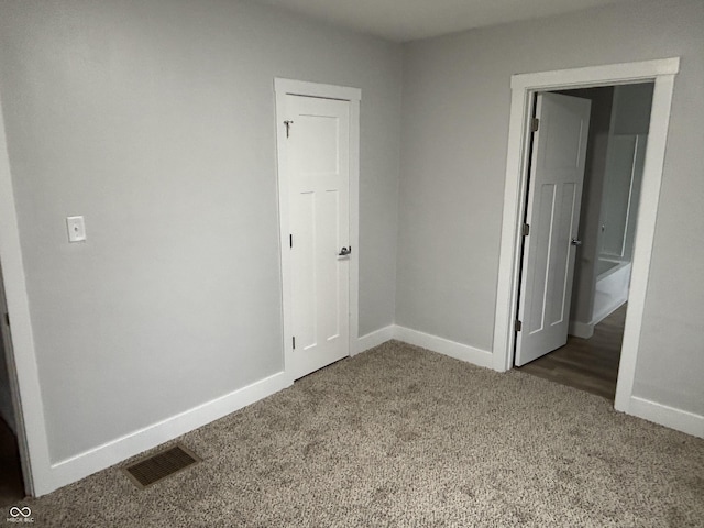 unfurnished bedroom featuring carpet flooring