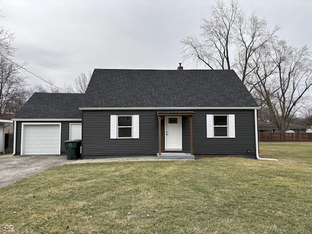 view of front facade featuring a garage and a front yard