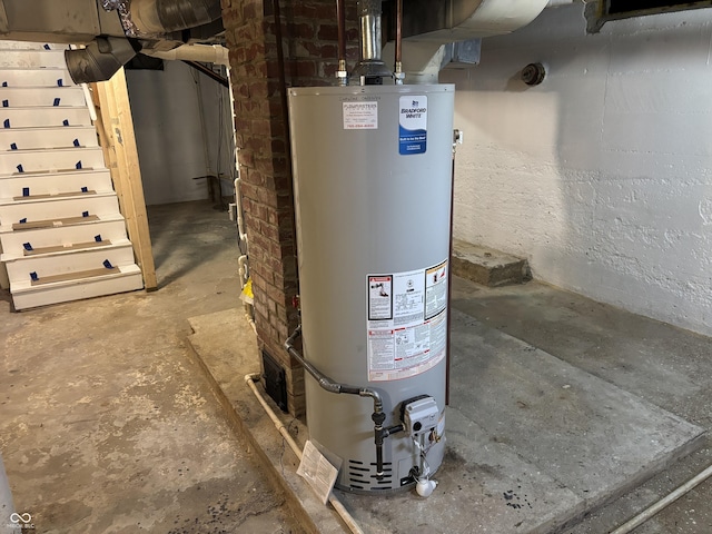 utility room featuring gas water heater