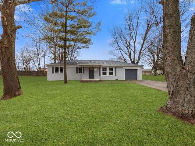 ranch-style house with a garage and a front yard