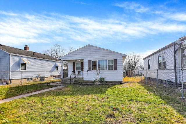 view of front of home with covered porch and a front yard