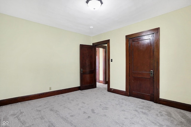 unfurnished bedroom featuring light colored carpet