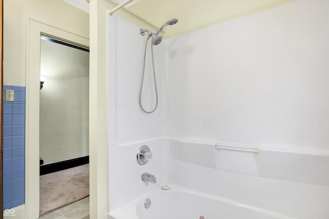 bathroom with bathing tub / shower combination