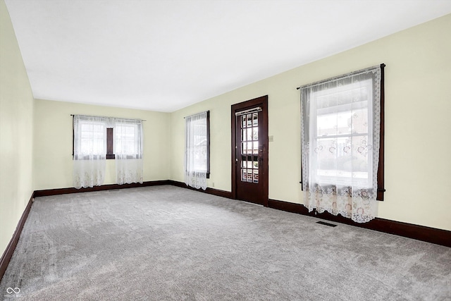 empty room featuring carpet floors