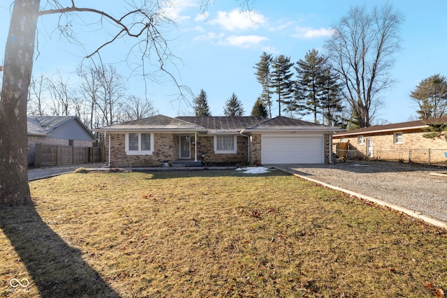 single story home with a garage and a front yard