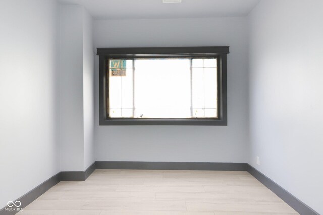 3707 N Kenwood Ave, Indianapolis, IN 46208 - unfurnished room featuring a healthy amount of sunlight and light wood-type flooring