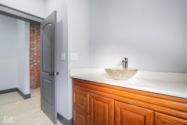 3707 N Kenwood Ave, Indianapolis, IN 46208 - bathroom with hardwood / wood-style flooring and vanity