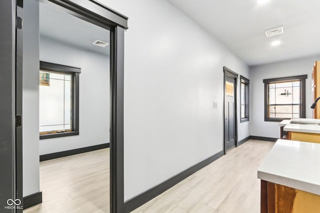3707 N Kenwood Ave, Indianapolis, IN 46208 - hall featuring sink and light hardwood / wood-style floors