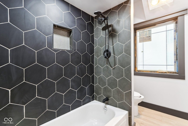 3707 N Kenwood Ave, Indianapolis, IN 46208 - bathroom featuring hardwood / wood-style flooring, tiled shower / bath, and toilet
