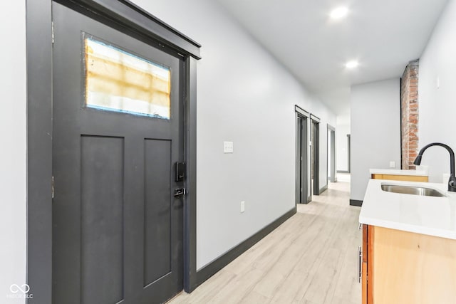 3707 N Kenwood Ave, Indianapolis, IN 46208 - foyer featuring sink and light wood-type flooring