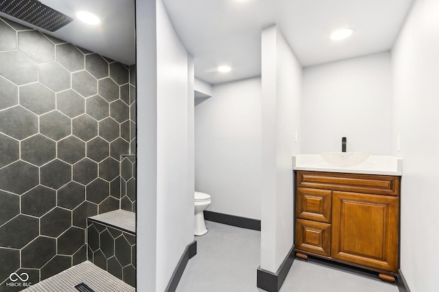 3707 N Kenwood Ave, Indianapolis, IN 46208 - bathroom with vanity, toilet, and a tile shower