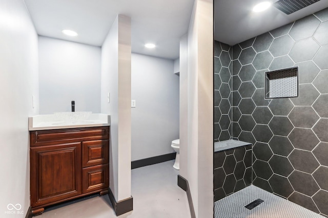 3707 N Kenwood Ave, Indianapolis, IN 46208 - bathroom featuring vanity, a tile shower, and toilet