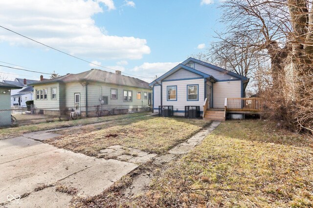 3707 N Kenwood Ave, Indianapolis, IN 46208 - view of front of home featuring a wooden deck, central air condition unit, and a front lawn