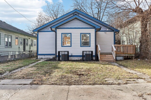 3707 N Kenwood Ave, Indianapolis, IN 46208 - view of side of home with a wooden deck, a yard, and central air condition unit