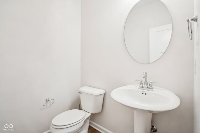 bathroom featuring sink and toilet