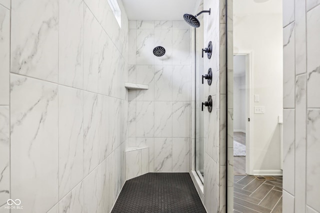 bathroom featuring tiled shower